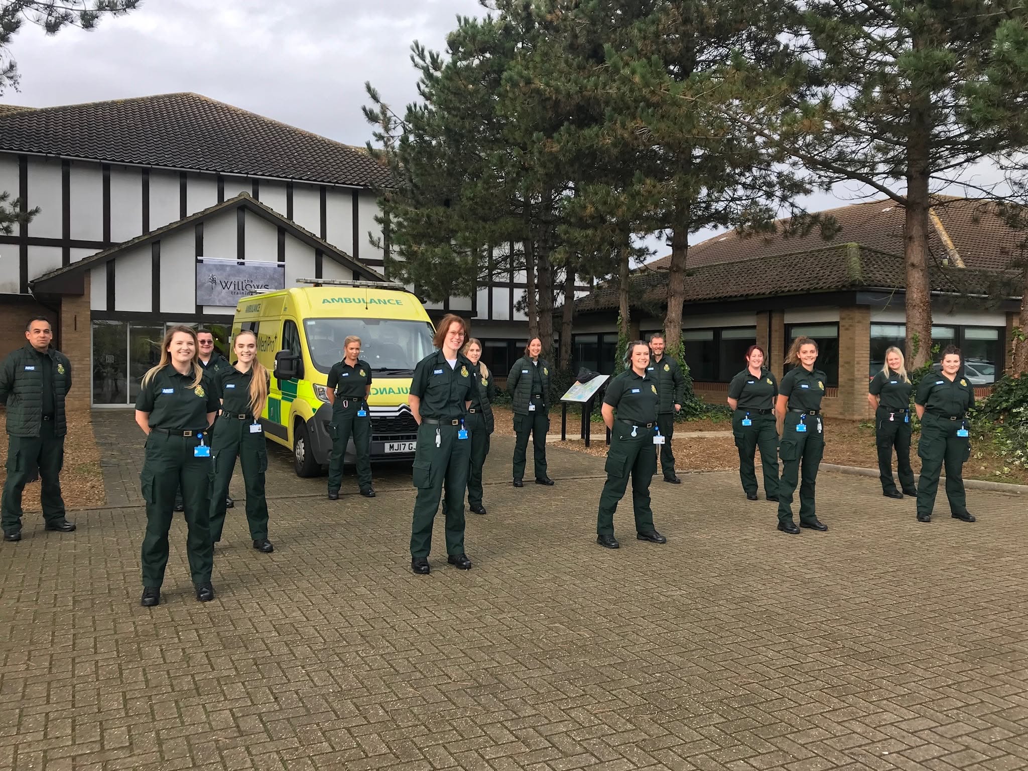 Medipro learners in uniform with a Medipro ambulance outside an employer training venue